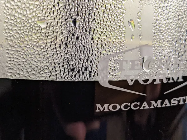 Closeup of a Mochamaster coffee pot with coffee and condensation in it